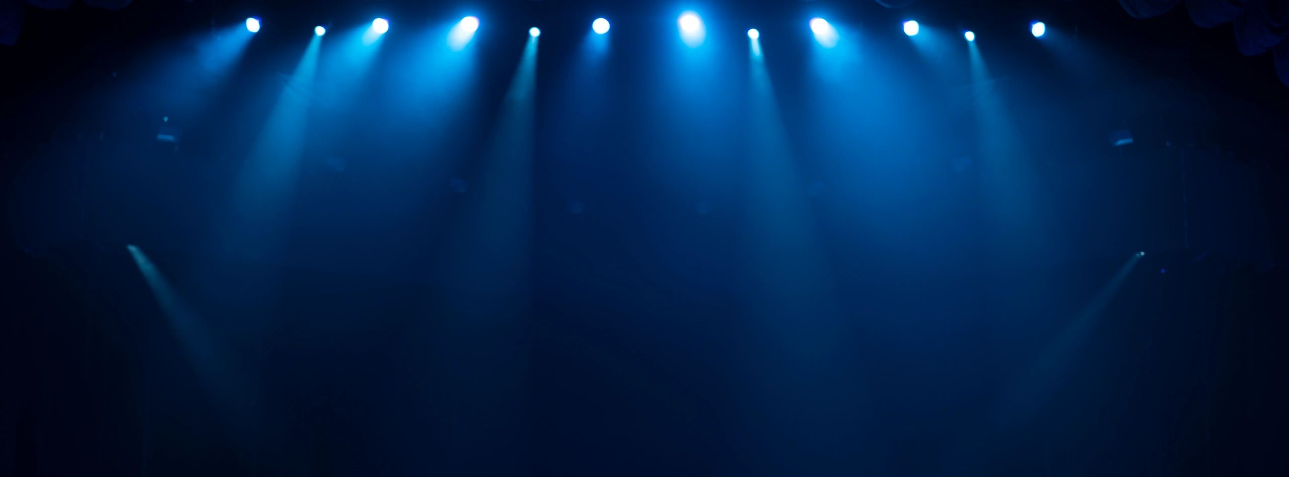 Blue stadium lights representing football preparation and game-day focus